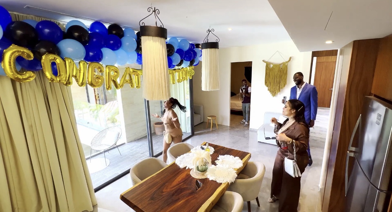 VOYAĠ clients gathered inside a decorated villa