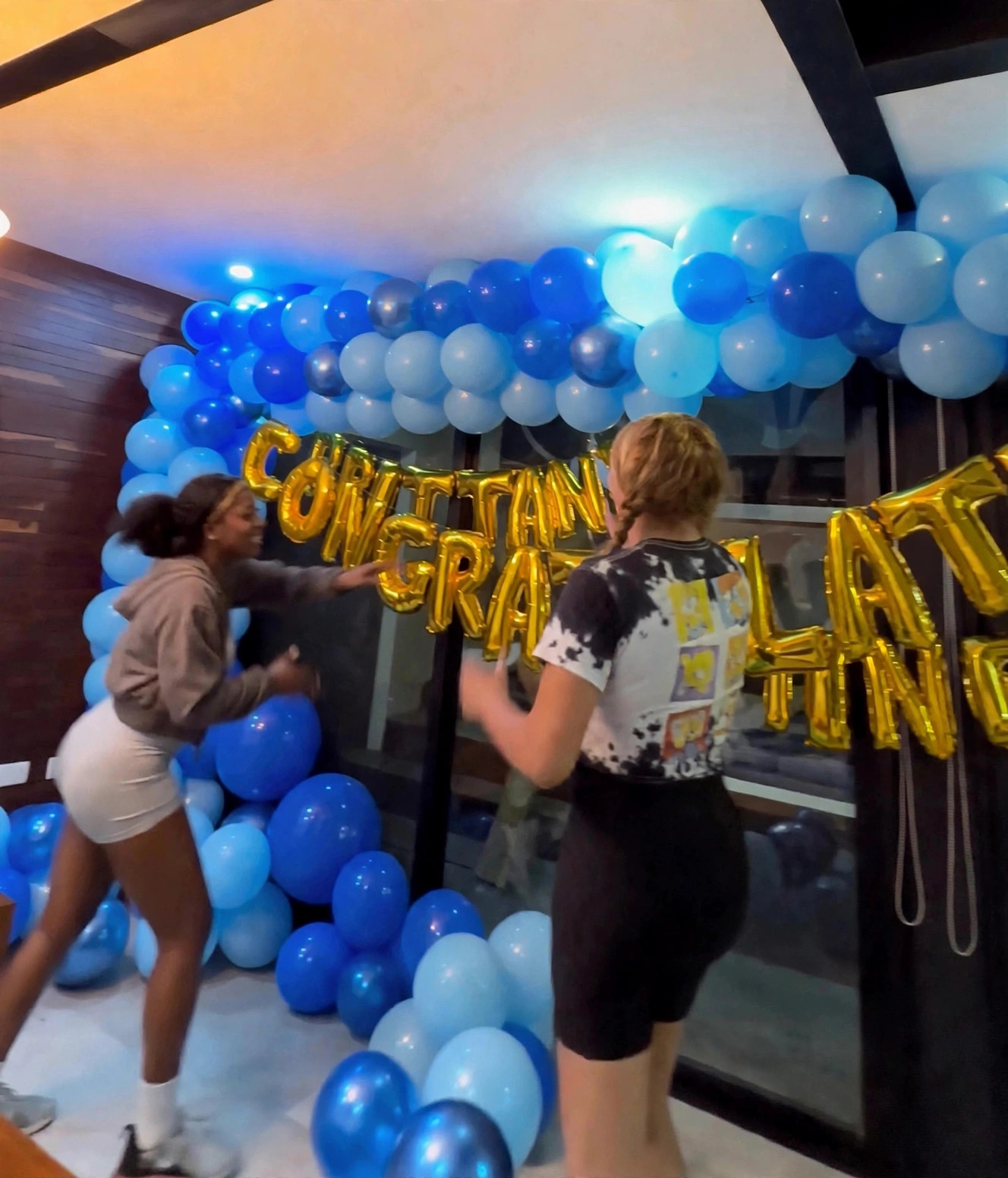 VOYAĠ clients celebrating together at a nighttime event