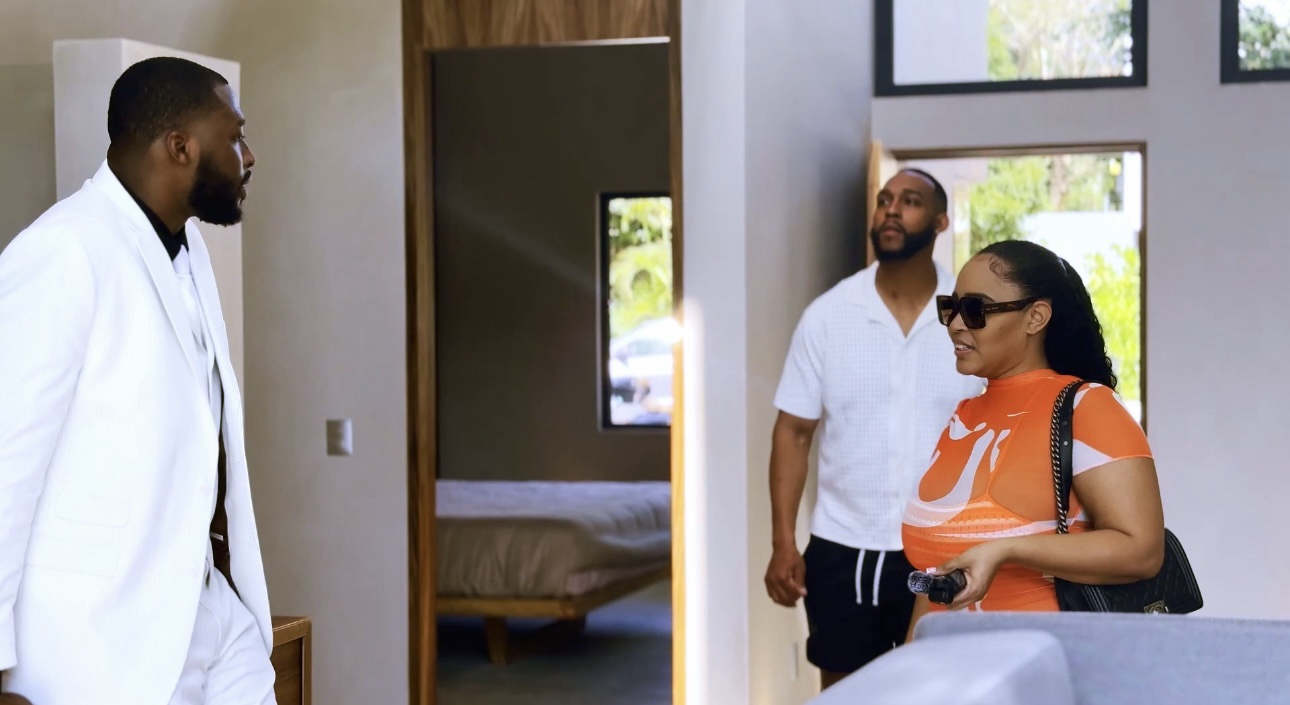 A client greeting a VOYAĠ team member at a doorway