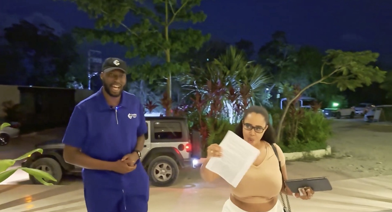 A client and VOYAĠ team member standing together outside a villa