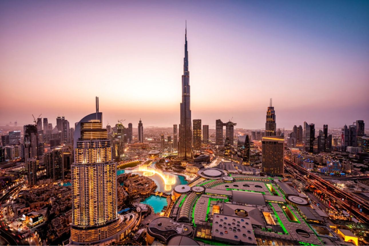 Dubai skyline at dusk with the Burj Khalifa rising above downtown