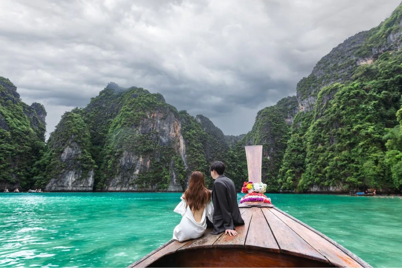 Long-tail boat among the limestone islands of Thailand