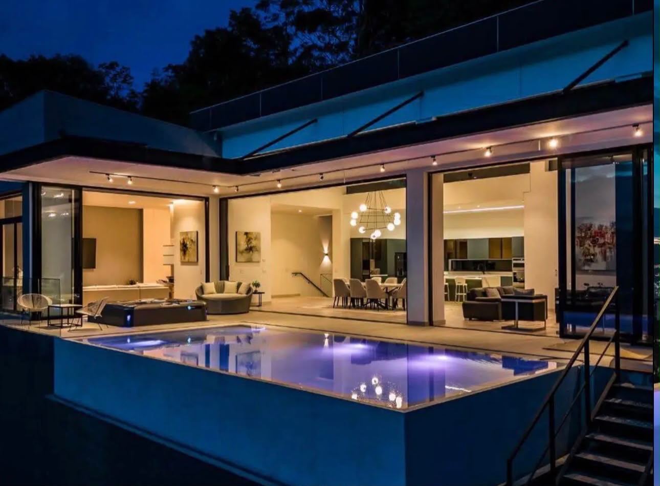 Night exterior of the Las Palmas villa with illuminated private pool