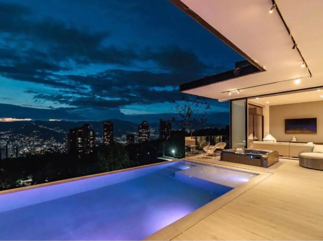 Pool terrace overlooking Medellín at night