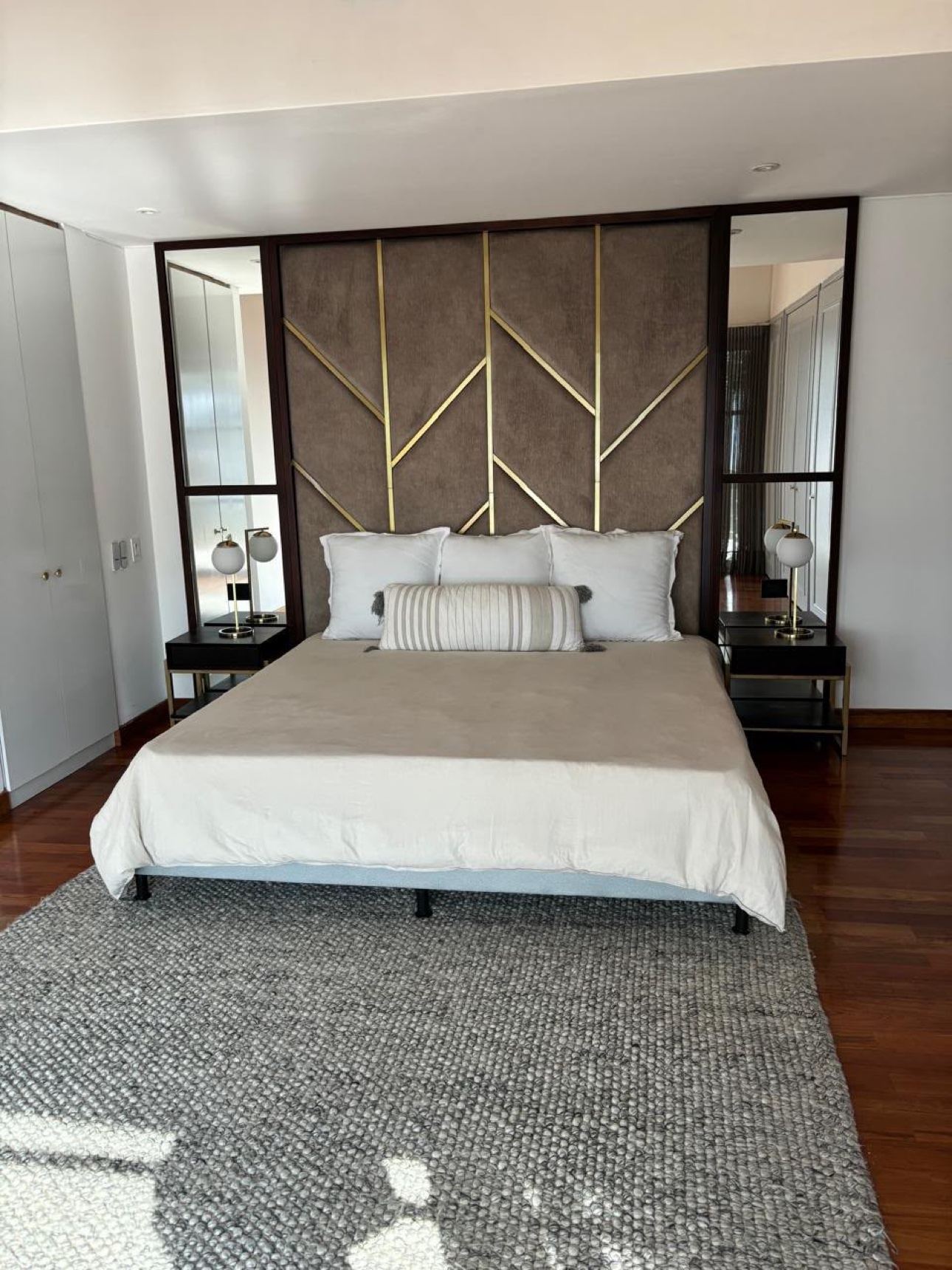 Bedroom with upholstered headboard