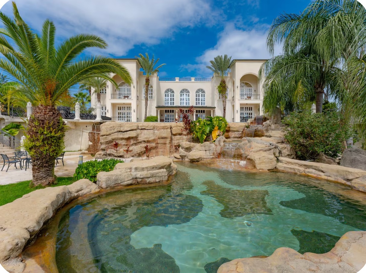 Pool courtyard and tropical landscaping at the six-bedroom mansion