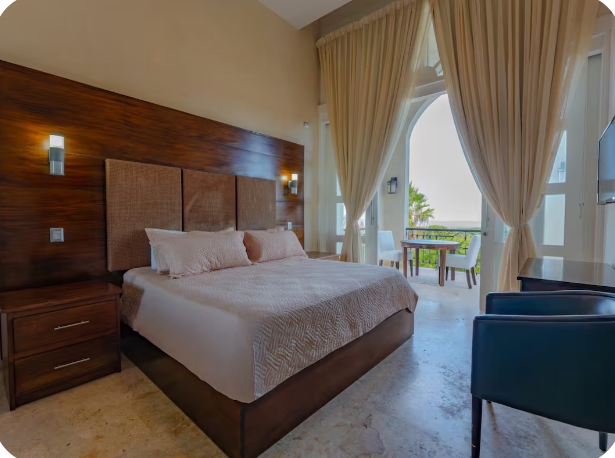 Bedroom suite with pool and jungle views at the mansion