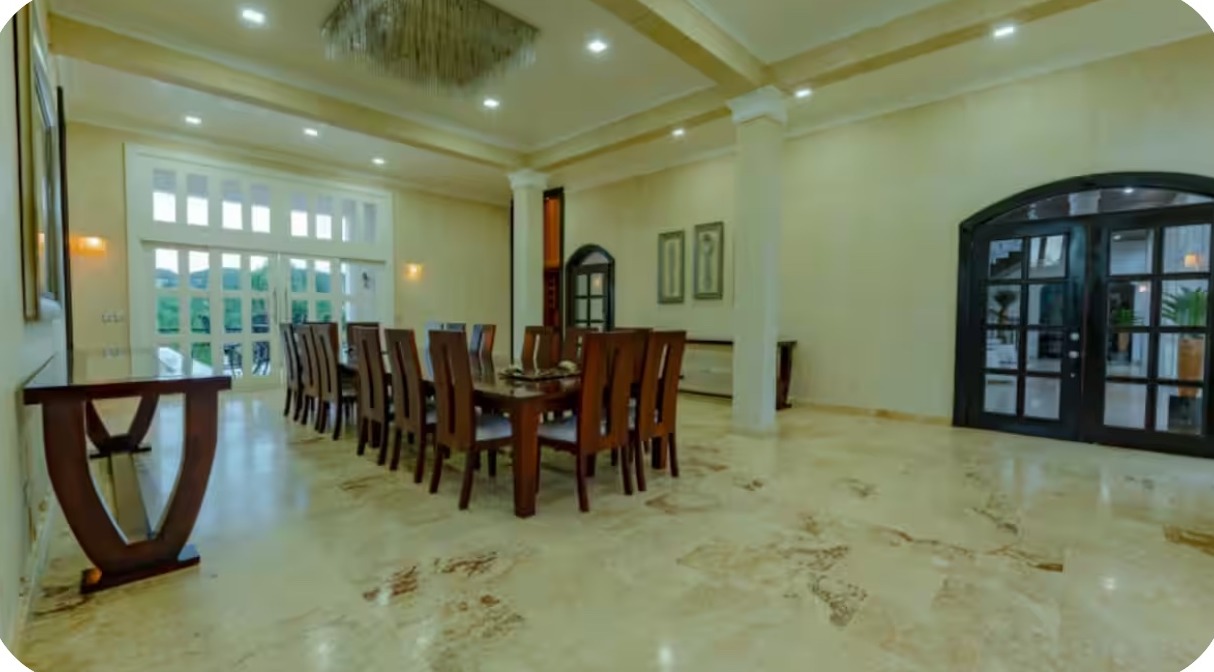 Dining area overlooking tropical grounds at the mansion