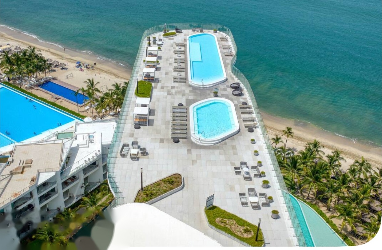 Aerial view of the rooftop pool and ocean at the five-bedroom oceanfront condo in Mexico
