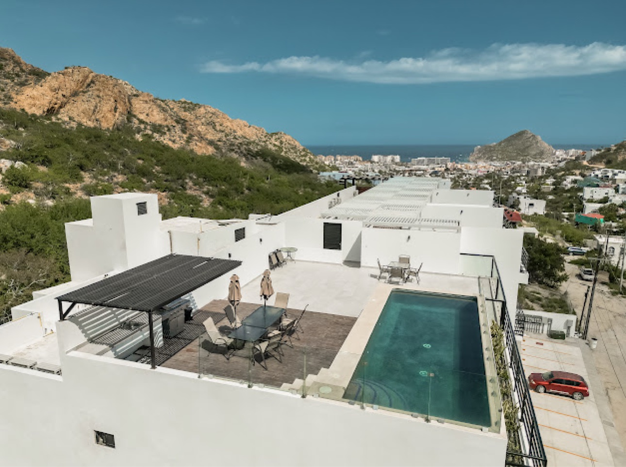Rooftop pool overlooking the sea and mountains at the three-bedroom condo in Mexico