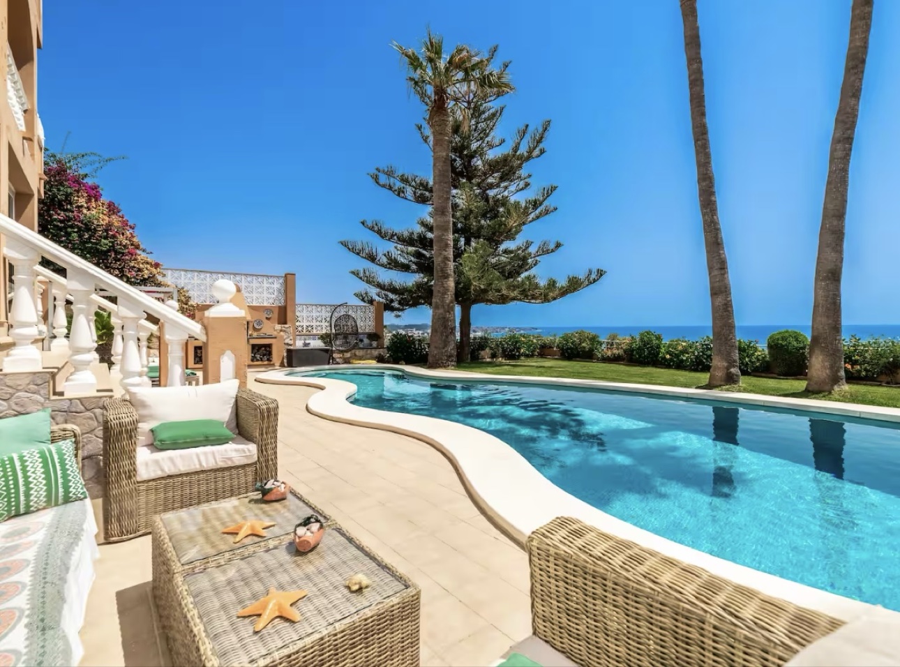 Pool loungers overlooking the sea at the five-bedroom Victorian Era villa in Spain