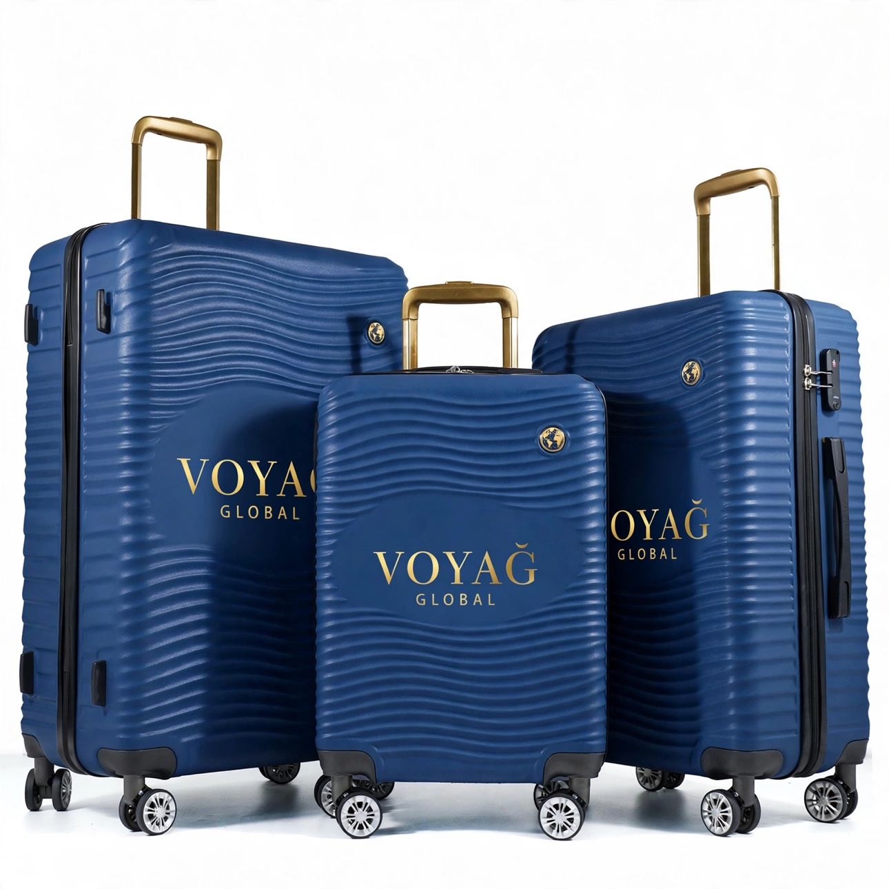 Navy hard-shell three-piece luggage set with gold VOYAG Global branding