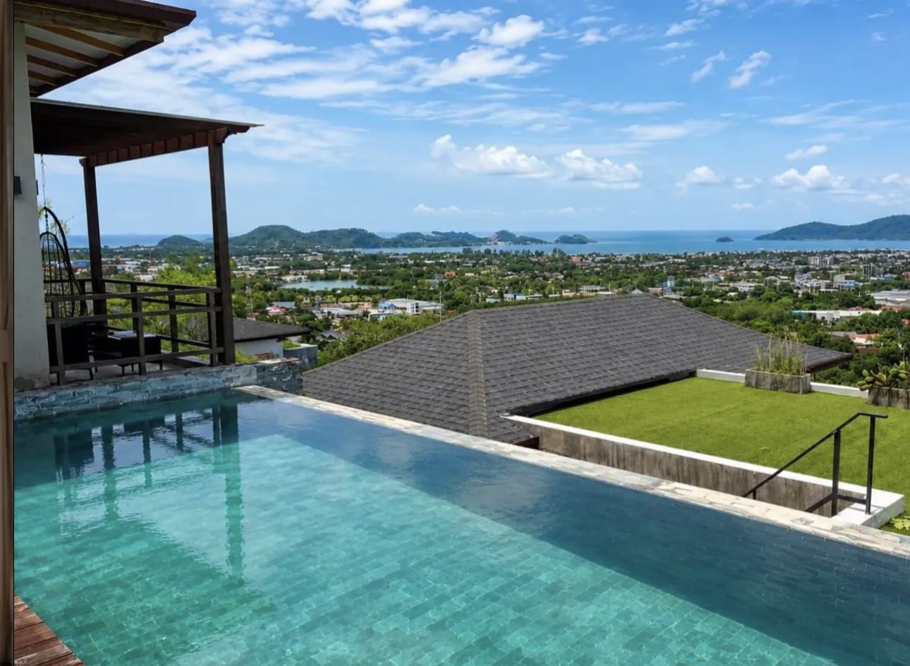 Infinity pool overlooking the ocean and hills in Thailand