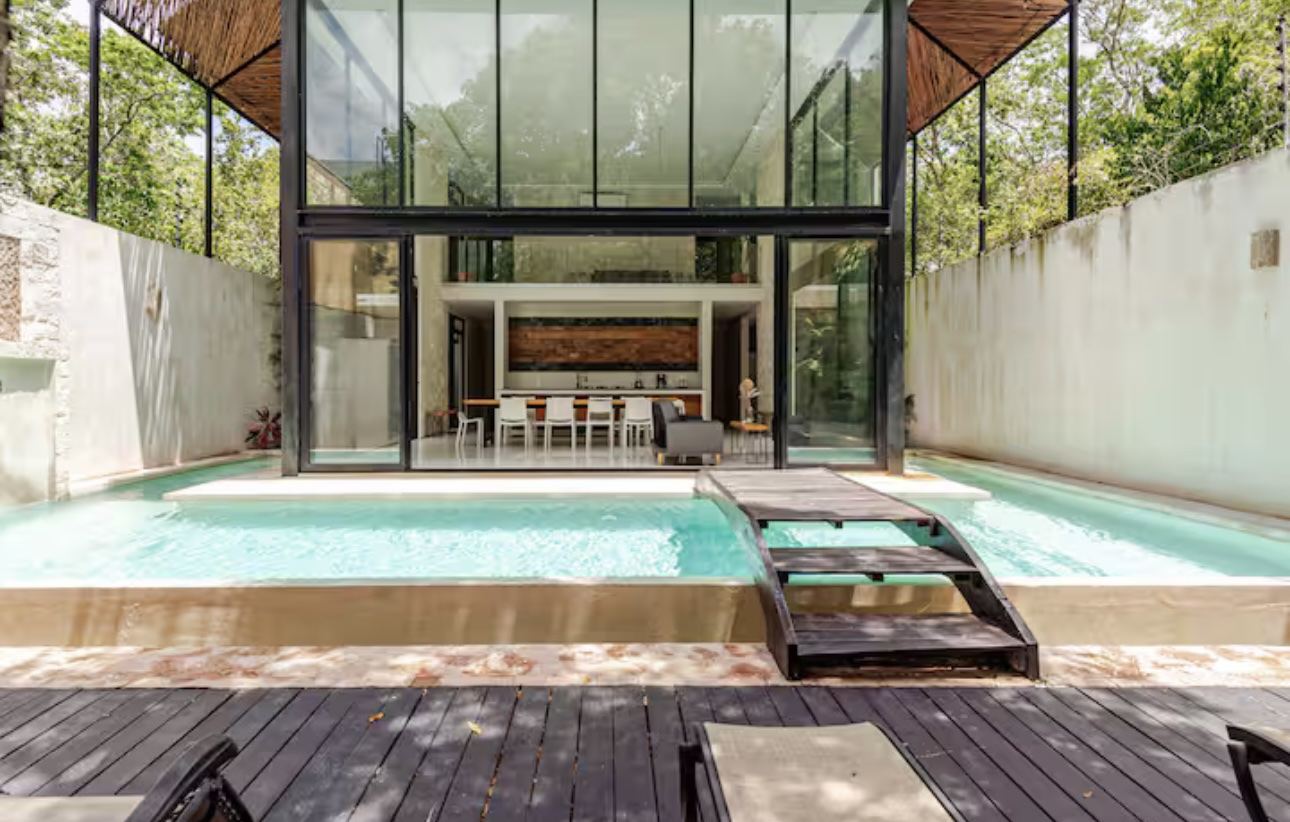 Poolside view of the four-bedroom jungle villa in Tulum